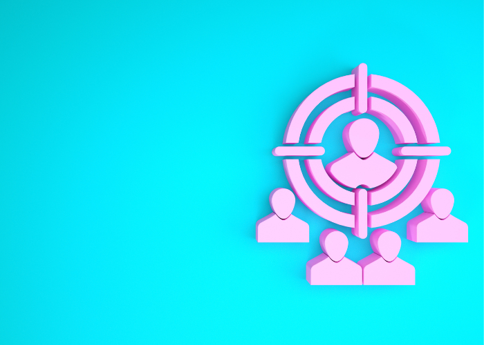 An image of a blue background with a pink illustration of a target and some silhouette of people in the centre and around it.
