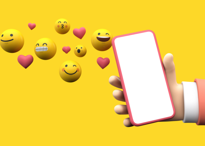 Illustration image that shows a hand holding a phone with a blank screen, next to it, several smiley faces and red hearts seem to be coming out of it.