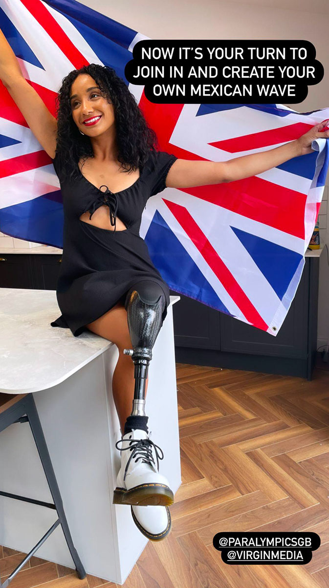 Sian Lord, a woman with a prosthetic leg, sits on a kitchen countertop spreading a Union Jack flag behind her. Text at the top says 