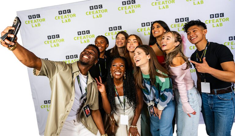 A diverse group of content creators pose for a selfie at the BBC Creator Lab workshops.