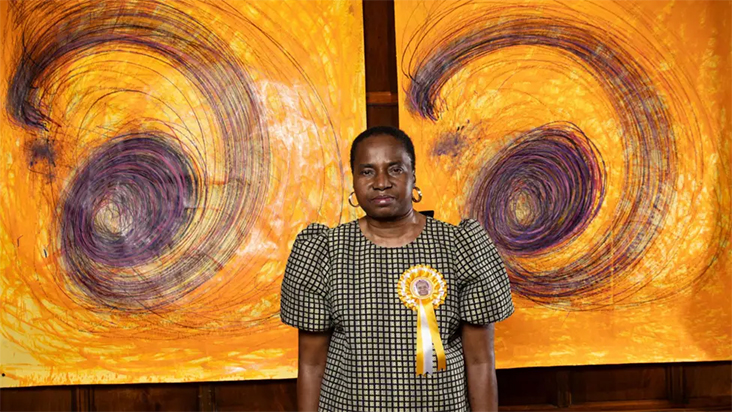 Kalu stands proudly in front of her work after winning the Turner Prize.