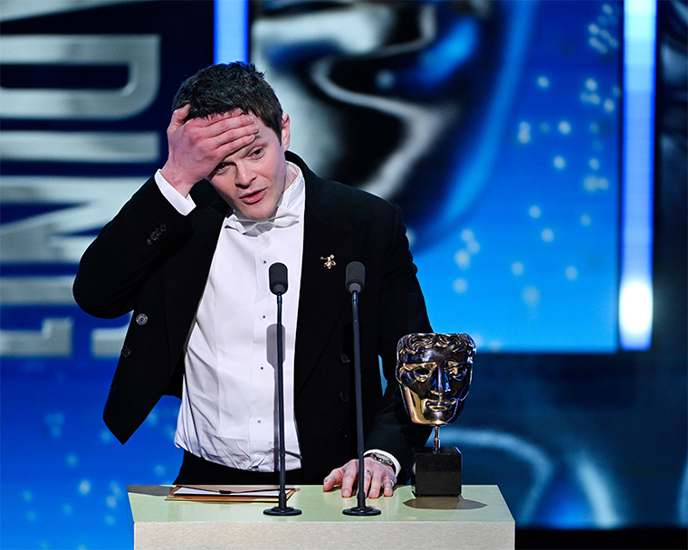 Robert Aramayo receiving the leading actor award at the Baftas for his performance in I Swear.