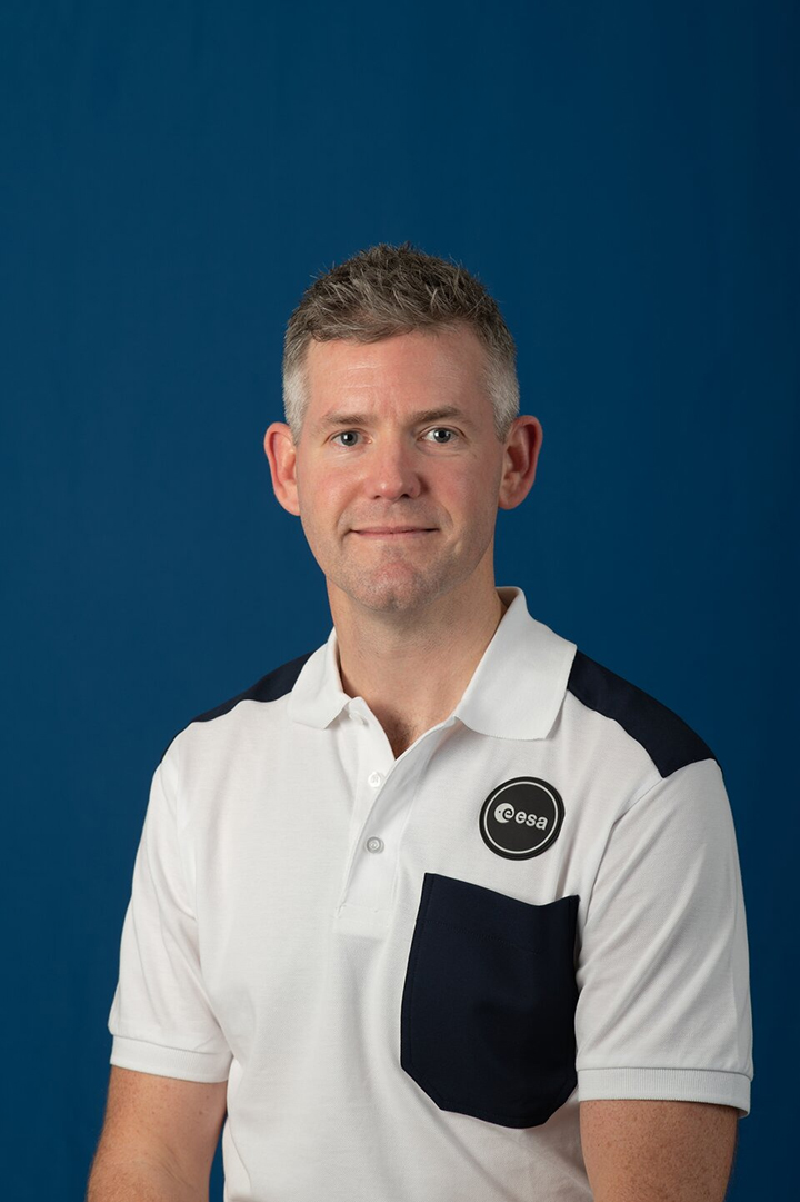 Formal headshot of John McFall in his work uniform.