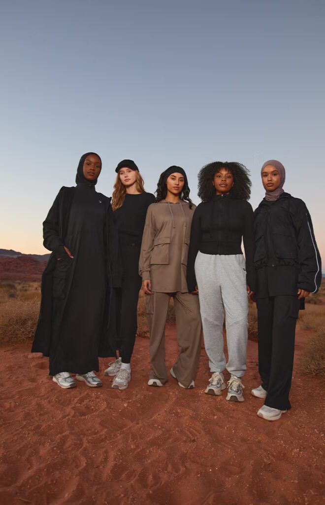 Leanna Deeb and a diverse group of female models pose in the new modest activewear collection from Gymshark.