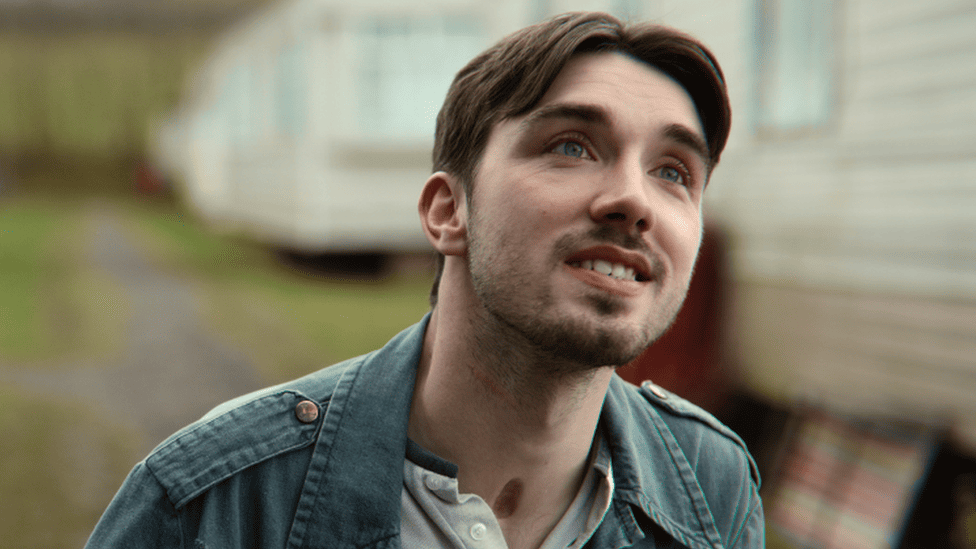 Single frame of Isaac from Sex Education in the Caravan Park.