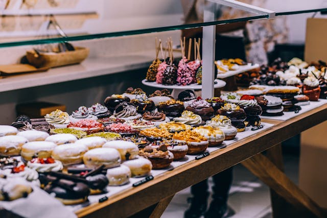 A spread of baked deserts with extravagant, sugary toppings.