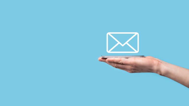 Blue background with an outstretched arm holding a mobile with a letter icon above.