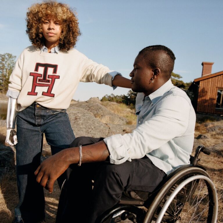Two disabled models showcasing Tommy Hilfiger's adaptive collection.