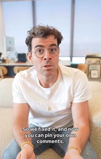 Mosseri sits on a sofa recording himself, talking about the new Instagram feature which allows you to pin your own comments. Text at the bottom reads: "So we fixed it, and now you can pin your own comments."