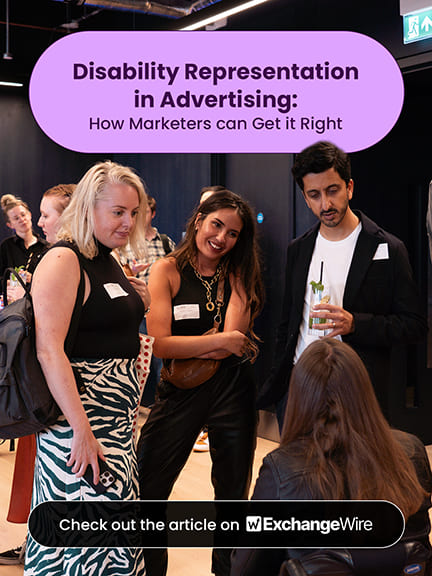 Business conversation between several people at one of Purple Goat's 'Included' events, including a manual wheelchair user. Text reads: "Disability representation: How marketers can get it right. Check out the article on ExchangeWire."