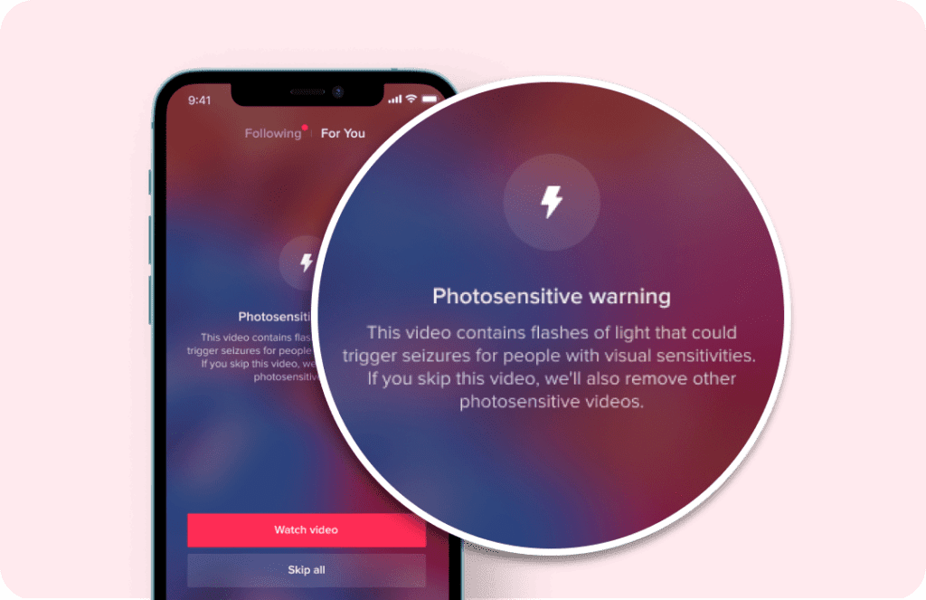 A phone displaying a Photo Sensitve Warning message to notify users with visual sensitivites that the video contains flashes of light. 