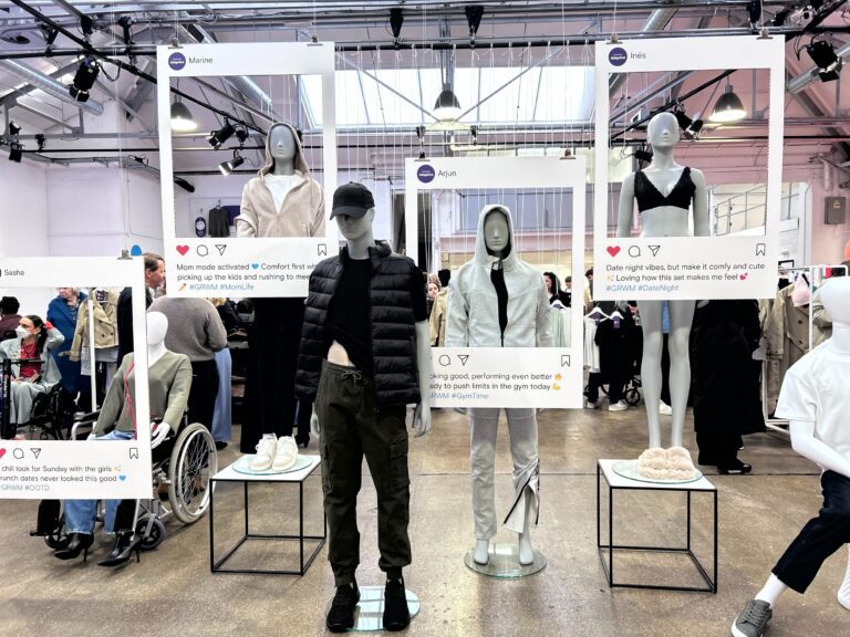 A range of adaptive clothes on mannequins at the Primark exhibition. Each one is framed by a mock-up Instagram post that creates a story for when someone would wear these.