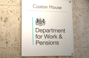 An image of a plaque with 'Department for Work & Pensions' on it.